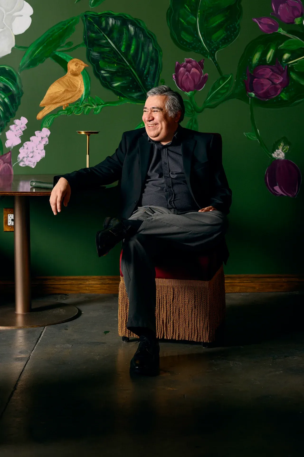 Owner portrait at Petronita's with hand-painted mural, Jacksonville